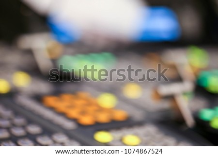 Blur of Switcher buttons in studio TV station, Audio and Video Production Switcher of Television Broadcast.