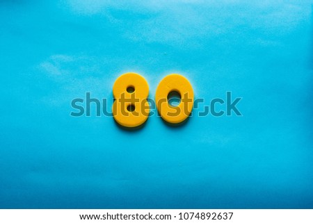 80 years old celebrating classic logo. Colored happy anniversary 80th yellow numbers. Greetings celebrates card. Traditional digits of ages.  Sale, birthday, special prize, % off concept.