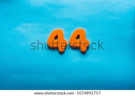 44 years old celebrating classic logo. Colored happy anniversary forty-four orange numbers. Greetings celebrates card. Traditional  digits of ages. Sale, birthday, special prize, % off concept.