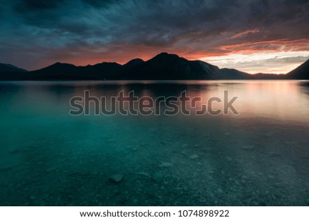 Thunder storm at lake Walchensee in the Alps of Bavaria at sundown