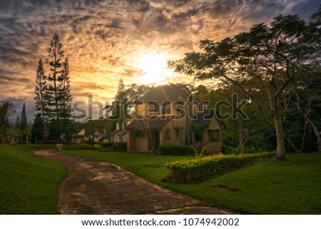 House of lake with sunset time and cloud fully the sky