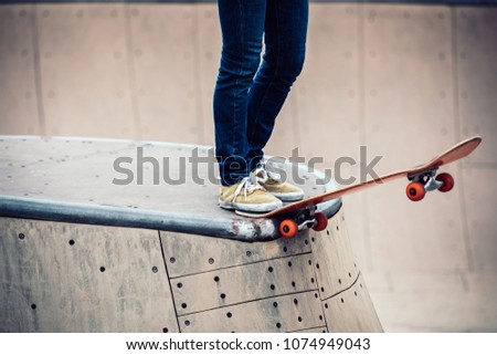 Skateboarder  skateboarding  on skatepark ramp