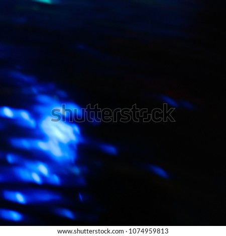 A free spirit captured. Visualization of a soul separated from a body, interacting with other yellow loose souls. This is what souls look like.  Blue Light Motion Blur.