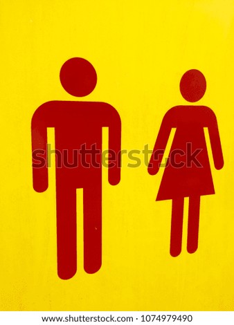 Man and woman sign on yellow background