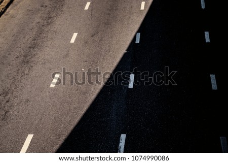 asphalt road with white lines