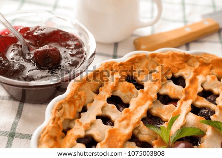 Delicious cherry pie on kitchen table