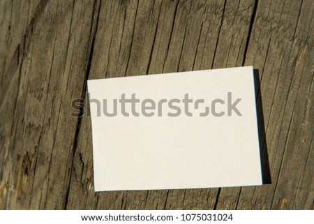 White paper on wooden post wood outdoor