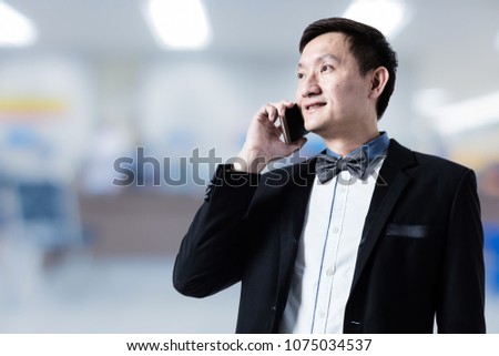 asian businessman in suit with blur background profile photo usage