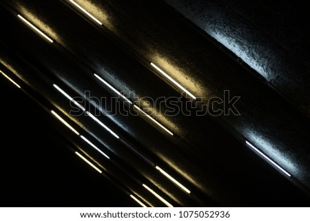 Dark ceiling texture with strips of light