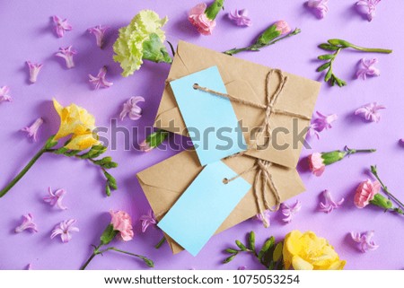 Composition with mail envelopes and flowers on color background