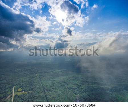 An amazing panoramic view. Drone photo with border clouds.