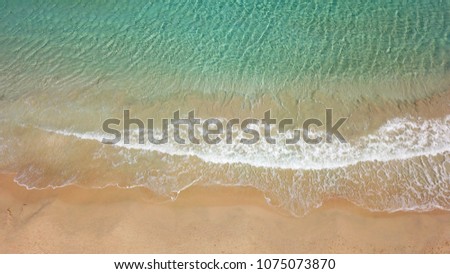Aerial photo of tropical beach with turquoise and sapphire clear waters
