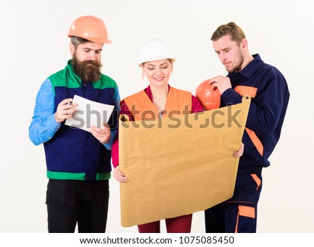 Construction plan concept. Team of builder, engineer, architect work on project. Men and woman in hard hats, architects on cheerful faces looks at drawing, plan, blueprint, project, white background.