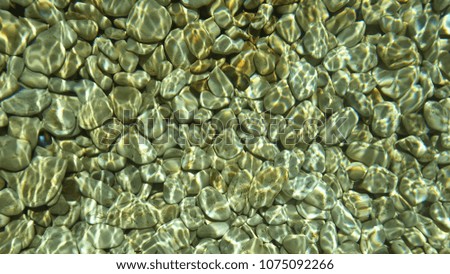 close up under water stones surface
