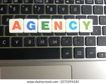 Word Agency on keyboard background