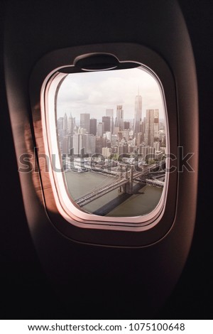 aerial view of Manhatten, New York City, seen through an airplane window