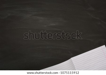 open College-ruled in the bottom right corner on the chalk Board