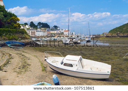 Picture of boats, standing at low tide on the coast of the island Belle Ile en Mer. France.