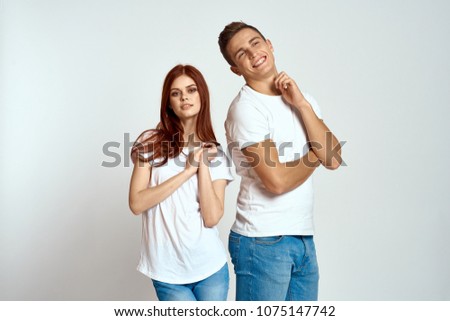 young couple in white T-shirts, logo