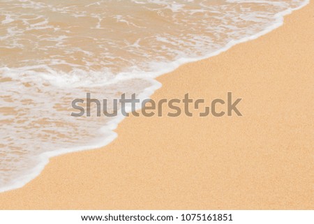 Texture background with surf, sea water and sand on the beach
