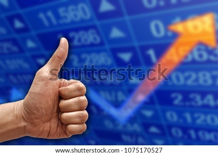 Hand with thumb up on monitoring growth up investment stock background.Business concept.Copy space for text, Blank free word.                    