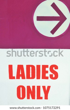 A picture of a sign and ladies only parking in a shopping mall near Kuala Lumpur