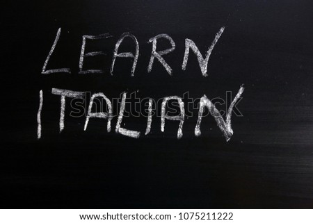 Learn italian text written on chalkboard, education concept