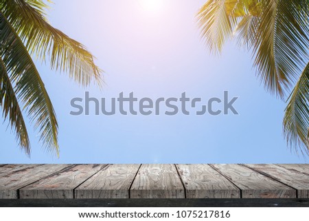 Empty wood Shelf on coconut leaves  background