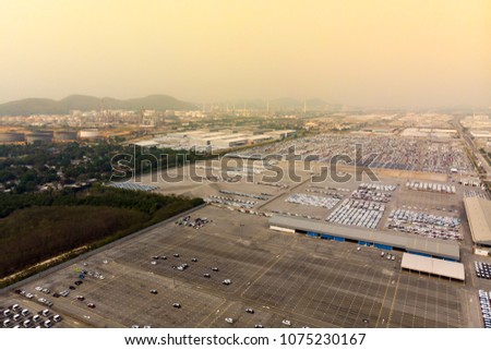 Bird's-eye view photo from flying drone,  New Cars produced Several times a year at industrial estate  for import export around in the world