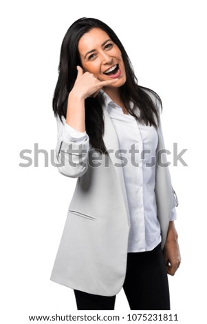 Pretty woman making phone gesture on white background
