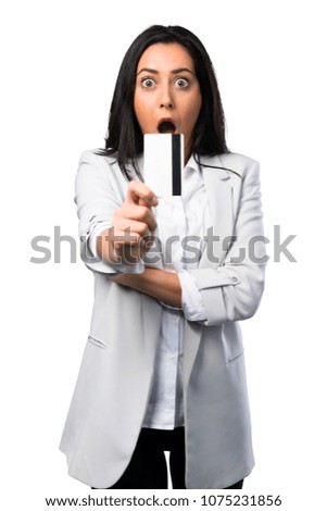 Pretty woman holding a credit card on white background