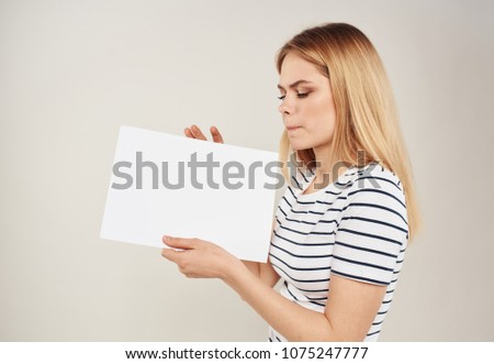 woman with a white sheet of paper,                              