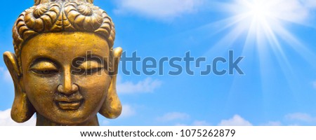 golden buddha in sunshine