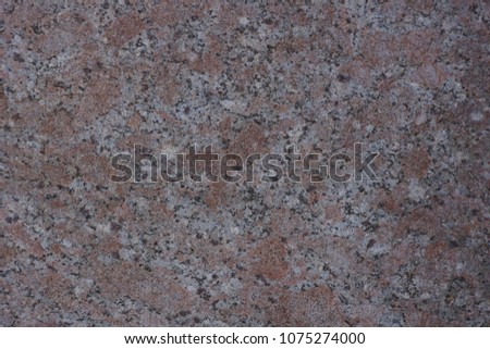 the texture of the granite walls of dark and light blotches plate