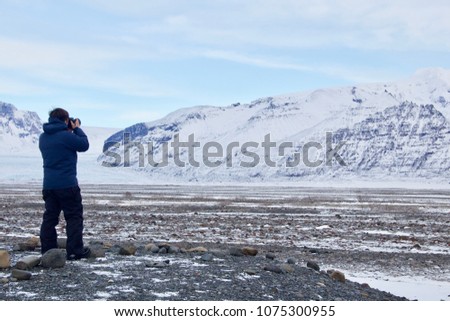 A man taking outdoor landscape in Iceland