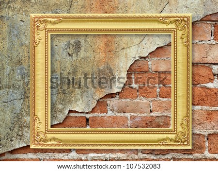 The antique gold frame on molder wall brick