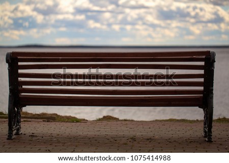 bench for relaxing with a view on the lake. empty bench in nature