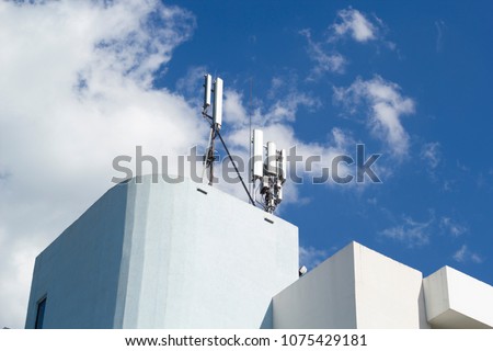 5G smart cellular network antenna base station on the telecommunication mast on the roof of the building. 3G. 4G. 5G. Telecommunication mast television antennas.
