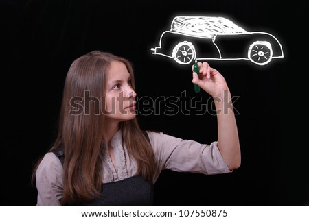 woman drawing car on black background
