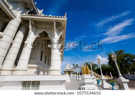 Beautiful buddhist Wat Kaewkorawaram temple in Krabi in southern Thailand. Cityscape with beautiful religion architecture in south east Asia.