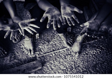 Children Raising hands in commercial building structure, World Day Against Child Labour concept.
 Royalty-Free Stock Photo #1075541012