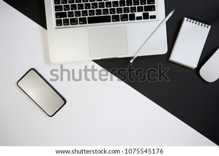 Top view of business man working stuff on black and white background. Modern working space. Flat lay.