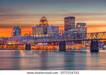 Louisville, Kentucky, USA downtown skyline at the river at dusk. Royalty-Free Stock Photo #1075556762
