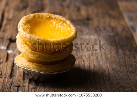 Home made Egg Tart  and custard cream sweet dessert on wooden background