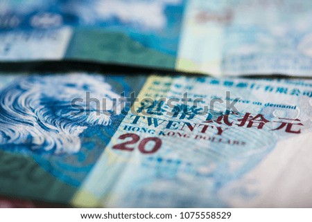 Pile of many Hong Kong Dollar banknotes as money background.