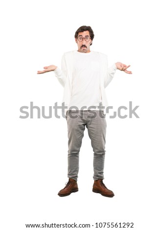 young crazy man thinking confused.full body cutout person against white background