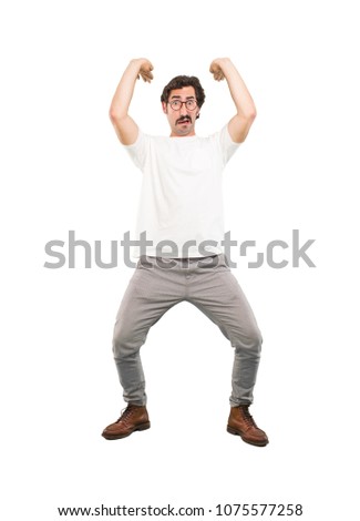 young crazy man pushing or holding sign.full body cutout person against white background