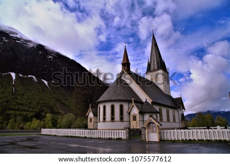 Traditional church in countryside of Norway on rainny day