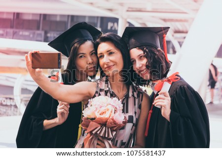 Beautiful woman congratulates for her family on graduation day, Successful concept