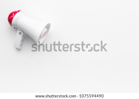 Attract attention concept. Megaphone on white background top view copy space Royalty-Free Stock Photo #1075594490